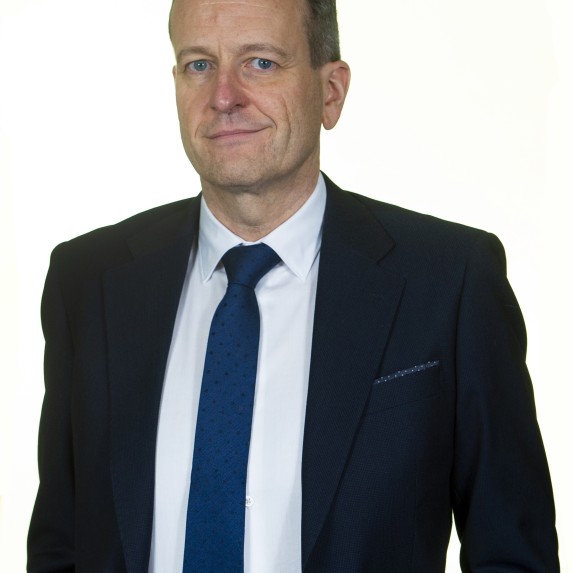 Derek Marchant, ScotRail Finance Director, wearing a blue suit and tie